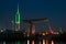 Illuminated radio tower and Rijnhaven bridge along the river Old Rhine in Holland.