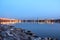 Illuminated railway bridge over the river Neva at sunset