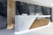 Illuminated reception desk in clean interior side