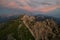 Illuminated reddish clouds over Mangart Pass and road, Julian Alps, Triglav national park, Slovenia, Europe