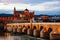 Illuminated Roman bridge and La Mezquita at sunset in Cordoba, Spain