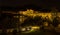 The illuminated Roman bridge and old town of Cordoba, Spain viewed from the river bank at night