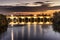 Illuminated Roman bridge over  Guadalquivir river at evening in Cordoba, Andalusia, Spain