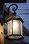 Illuminated rustic lantern on the porch