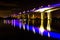 Illuminated Sir Leo Hielscher Bridges reflected in the water below at night