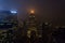 Illuminated Skyscrapers in Manhattan New York City fading Away in the Fog at Night.