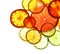 Illuminated slices of citrus fruits on white background