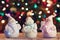 Illuminated Snowman and Jack Frost (Santa Claus) dolls in front of Christmas tree lights, blurred background