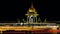 Illuminated statue of Chamarajendar Woodeyar (king of Mysore) against a starry night sky