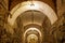 Illuminated stone and brick basement corridor