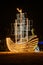 Illuminated straw ship located in the city