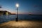 Illuminated street light with seascape backdrop, Chania town, Cr