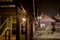 Illuminated street with wooden houses in the evening