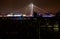 Illuminated Suspended bridge over railway urban modern landmark city night scene