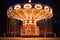 Illuminated swing chain carousel in amusement park at the night