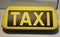 Illuminated Taxi sign, lying on a table