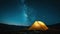 Illuminated tent under glowing night sky with stars and milky way. Tourist equipment for camping