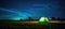 Illuminated Tent Under Star-Streaked Night Sky: A Generative AI Scene