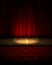 Illuminated theater stage with a red curtain. Highly realistic