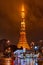 Illuminated Tokyo Tower reflecting in the wet streets of Tokyo Japan