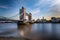 The illuminated Tower Bridge and skyline of London, UK, just after sunset