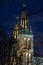 Illuminated towers of the neo gothic basilica of apostles Peter and Paul at Vysehrad castle in Prague at night