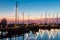 Illuminated traditional wooden fishing ships at night in Dutch harbor