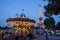 Illuminated Vintage Carousel and Eiffel Tower