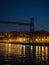 Illuminated Vizcaya transporter bridge in Getxo Portugalete over Nervion river Bilbao Basque Country Spain at dusk