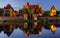 Illuminated walls of the Malbork Castle at night