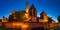 Illuminated walls of the Malbork Castle at night-panorama