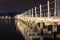 Illuminated wooden pier at night