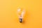 Illuminating Creativity: One Floating Light Bulb on Coloured Background AI Generated