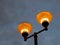 Illuminating pole against a stormy sky