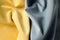 Illuminating Yellow and Ultimate Grey colors velour fabric. Colors of year 2021. Fabric texture background