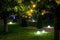 Illumination backyard light garden with electric ground sphere lantern.
