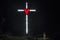 Illumination of a cross with red heart