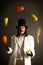 Illusionist juggling with fruits
