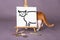 Illustrated cat on white canvas real cat standing behind canvas with tail sticking out