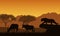 Illustration of African landscape and safari. A lioness or leopard hunts two antelopes. Orange sky with mountains and tropical