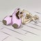 Illustration ballet shoes for ballet lying on top of each other pink purple and bow