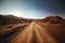 Illustration of a beautiful road in the middle of the desert between the mountains with the rays of the sun