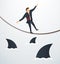 Illustration of a businessman walking on rope with sharks underneath business risk chance