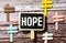 Illustration depicting a set of cut out printed letters arranged to form the word hope.