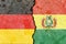 Illustration of the flags of Germany and Bolivia separated by a crack - conflict or comparison