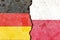 Illustration of the flags of Germany and Poland separated by a crack - conflict or comparison