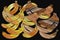 Illustration of group of orange beautiful bananas isolated on a black background