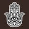 Illustration of a hamsa hand symbol.