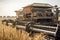 Illustration of harvester harvest wheat on a yellow field. Harverster working in the field. Agriculture filed harvesting wheat.