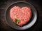 Illustration of meat mince shaped like a heart on a plate, representing the concept of love for meat